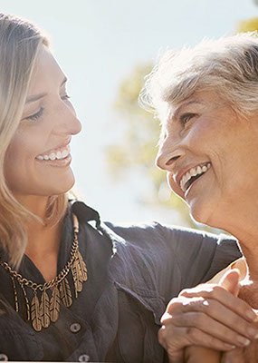 Mother and daughter with terrific smiles designed by Dr. Ev
